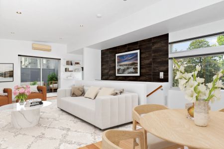 Modern Two-Bedroom Townhouse with Balcony and Secure Garage - Photo 2