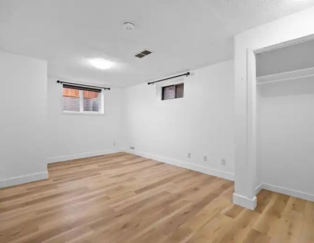 BRIGHT AND HUGE 2 BEDROOMS, LOTS OF WINDOWS, HUGE PARKING | 39 Aberdare Crescent Northeast, Calgary - Photo 1