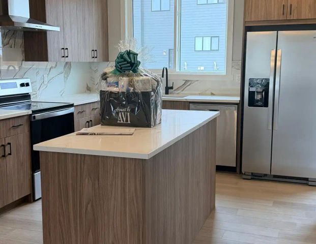 Bright 3 Bedroom + Den Duplex in Starling, NW Calgary. Available Now — 3 Bedrooms+ Den Main Floor - Photo 1