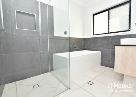 MODERN FAMILY HOME WITH MULTIPLE LIVING AREAS! - Photo 2