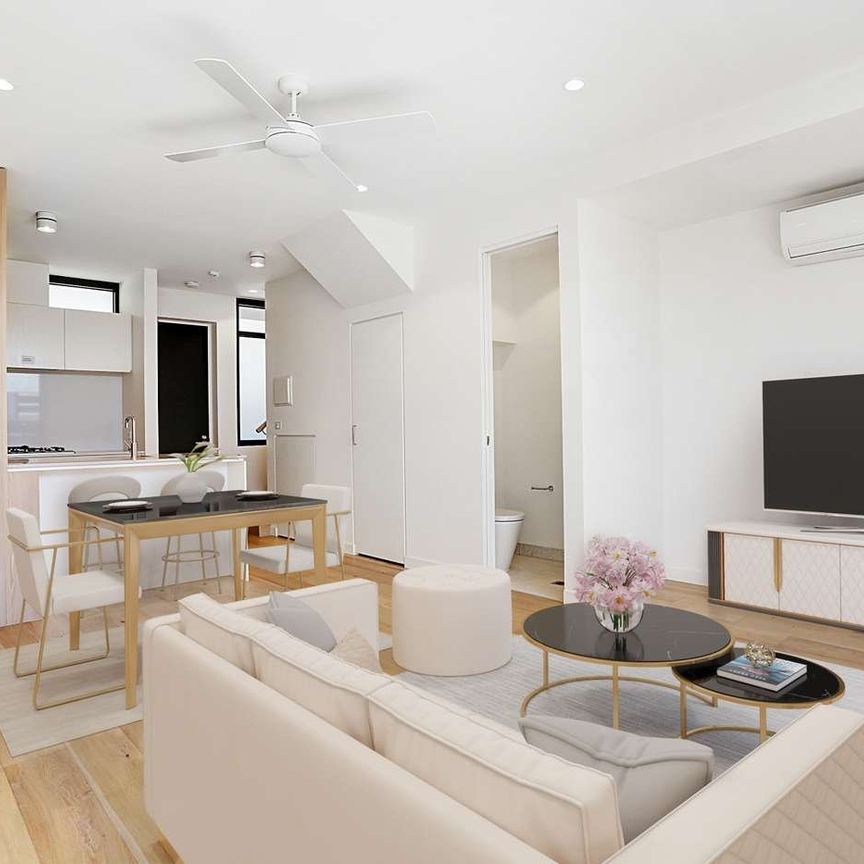 STYLISH DOUBLE-STORY APARTMENT WITH MODERN AMENITIES - Photo 1