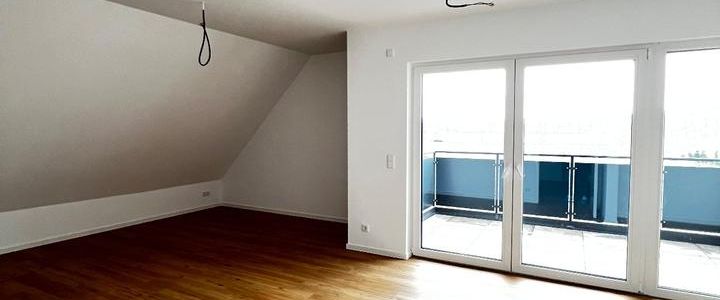 Exklusive Dachgeschosswohnung mit Balkon und Carport erwartet sie hier! - Foto 1