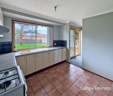 Three-bedroom family home featuring a large backyard - Photo 6