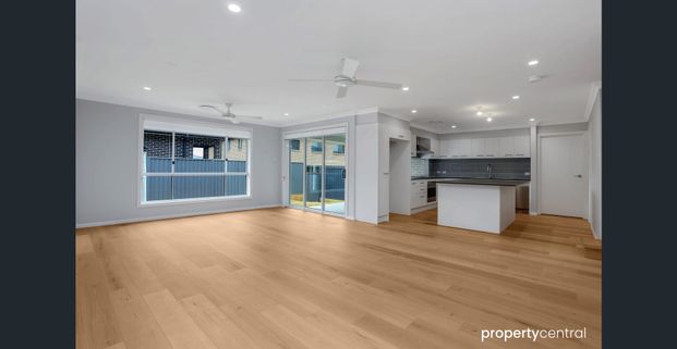 BRAND NEW 5 BEDROOM HOME - Photo 1