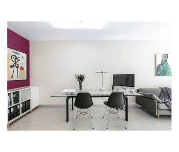 Sunlit NE-Facing Split-Level Gem | Communal Rooftop | Walk to CBD! - Photo 1