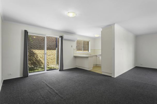 Comfortable & Well-Laid-Out 3-Bedroom Home with Versatile Living Spaces - Photo 1