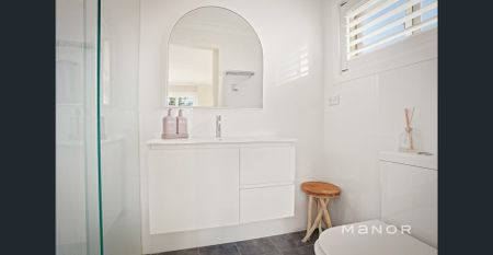 Stylish Family Home with Spa, Modern Comforts & Drive-Through Garage! - Photo 4