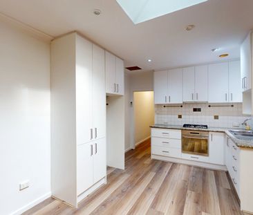 NEWLY RENOVATED TWO-BEDROOM RESIDENCE WITH SECURE PARKING - Photo 1