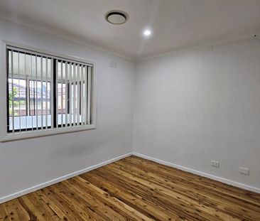 Spacious Family Home with Dual Living Areas and Large Backyard - Photo 2