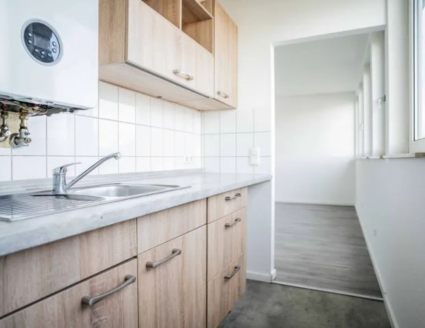 Nettes Dachgeschoss-Appartement mit Einbauküche und Aufzug in ruhiger Lage - Foto 1