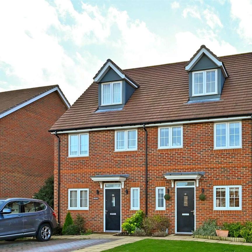 Situated in a peaceful location with open green space to the front, this spacious family home is arranged over three floors and offers well-presented accommodation throughout. - Photo 1