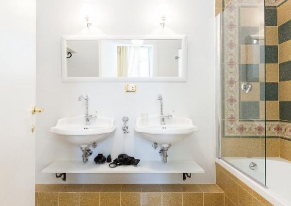 Center-Historic Jewish Quarter: Elegant apartment situated in beautiful Palazzo Nobiliare. Entrance, spacious living with original wood frescoed ceilings, large modern dining and kitchen, 4 bedrooms, 4 Baths, small terrace. #1527