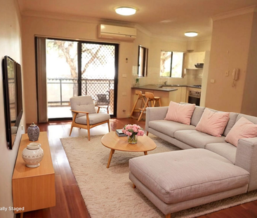 SPACIOUS 2 BED 2 BATHROOM UNIT WITH LOCKUP GARAGE - Photo 2