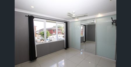 TOP FLOOR TWO-BEDROOM UNIT WITH BALCONY AND PARKING - Photo 5