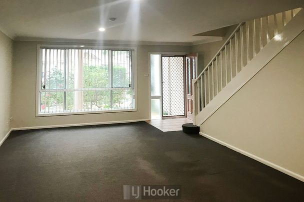 UPDATED THREE BEDROOM TOWNHOUSE BY THE LAKE! - Photo 1