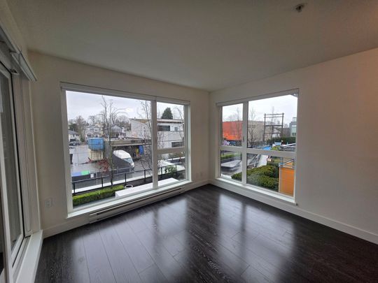 Stylish One Bedroom + Den Residence with Private Balcony - Photo 1