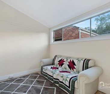 COMFORTABLE TWO-BEDROOM HOME WITH VERSATILE RUMPUS ROOM - Photo 1