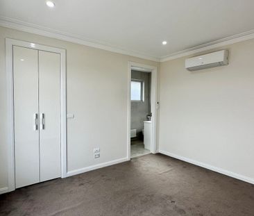 ARCHITECTURALLY DESIGNED TOWNHOUSE IN THE MCKINNON SCHOOL ZONE - Photo 2
