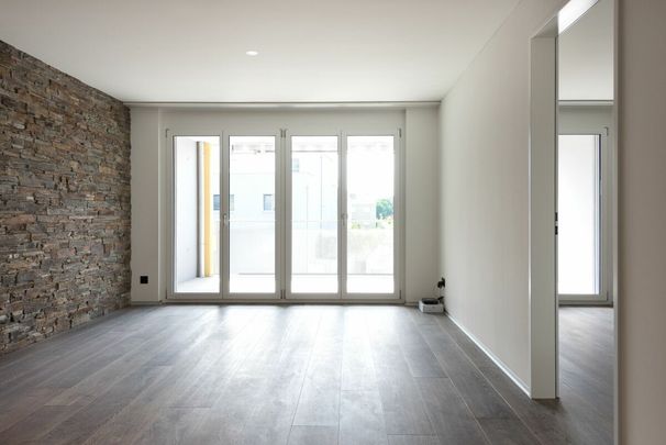 Moderne Erdgeschoss-Wohnung mit grosszügigem Sitzplatz! - Photo 1