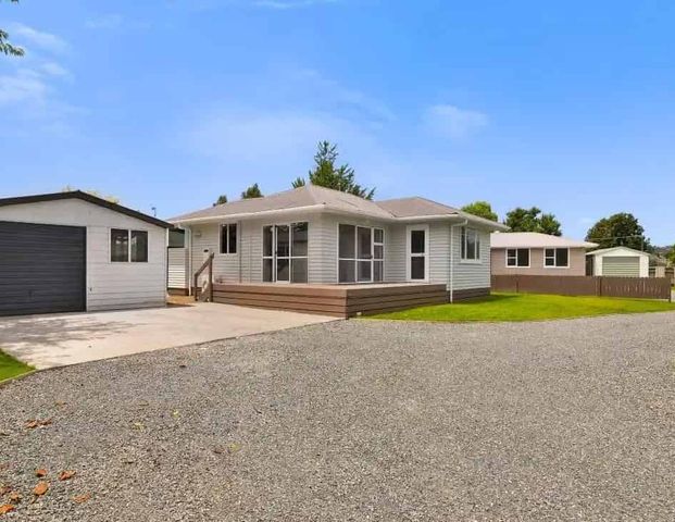 Tidy Family Home with Garage - Photo 1