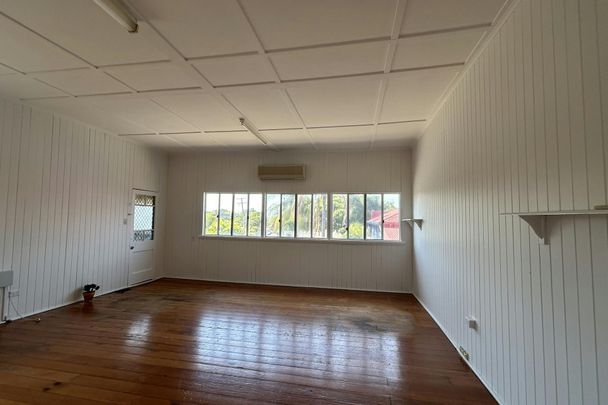 SPACIOUS QUEENSLANDER WITH EXTRA MULTI PURPOSE ROOM AVAILABLE NOW! - Photo 1