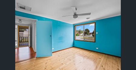 Family home with large backyard and multiple living spaces - Photo 2