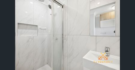 Spacious Brick & Tile Family Home with Huge Powered Shed & Remote Gate! - Photo 4