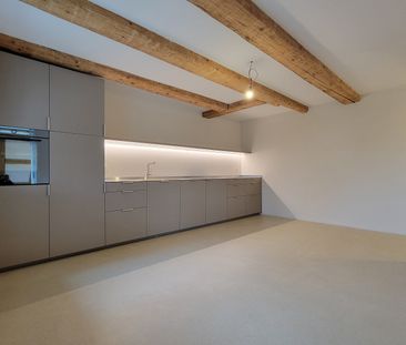 Neubau - Charmante Wohnung mit Sichtbalken und grossem Turmbalkon! - Photo 2