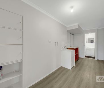 THIS PROPERTY OFFERS LOW MAINTENANCE LIVING WITH A SPACIOUS YARD , ... - Photo 2