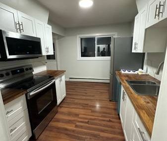 Spacious 2bd apartment with ALL utilities & assigned parking included - Photo 2