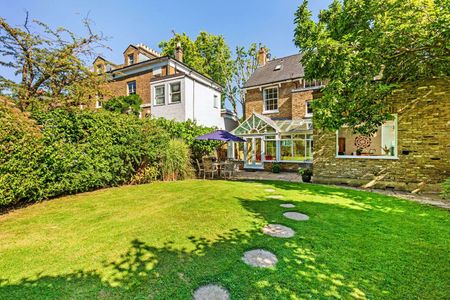 A well presented detached family home with generous parking and a delightful garden, backing directly onto The St Margarets Pleasure Gardens. - Photo 3