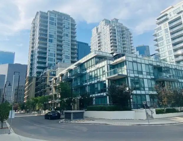 Beautiful 1 Bed Downtown Waterfront Condo | 411 - 51 Waterfront Mews SW, Calgary - Photo 1