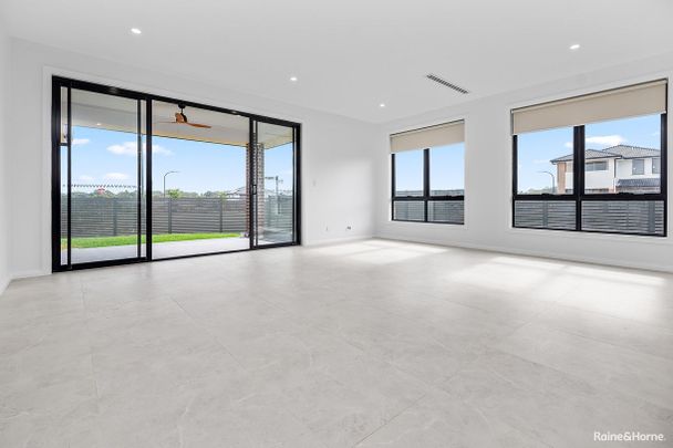 Modern Family Living in a Near-New Home - Photo 1