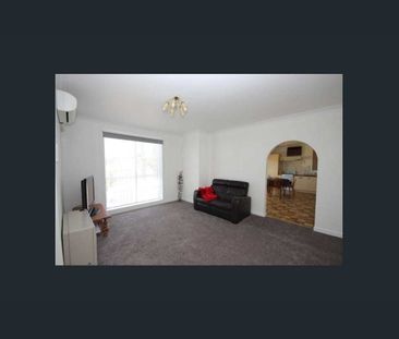 Charming Family Home with Sunroom, Spacious Yard & Garage - Photo 6