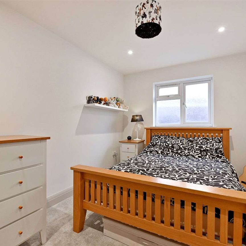 This versatile bungalow includes three bedrooms, principal with dressing room and ensuite, a stunning open plan kitchen with bi-fold doors, and a garden with a heated studio and WC. - Photo 1