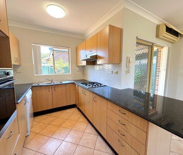 Spacious 3 Bedroom Full Brick Villa - Photo 1