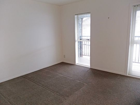 Townhouse Living in fully gated complex with 2 carparks - Photo 1