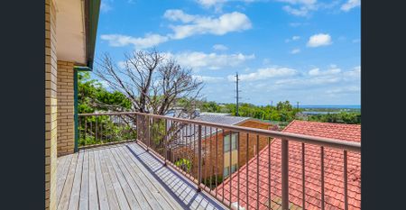 Spacious 3-Bedroom Top Floor Unit with Ocean Views & Character Features - Photo 5