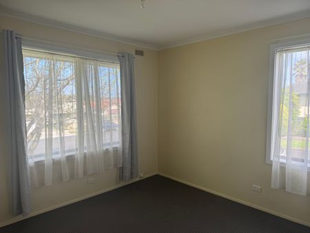 Neat Three-Bedroom Home in Prime Location - Photo 2