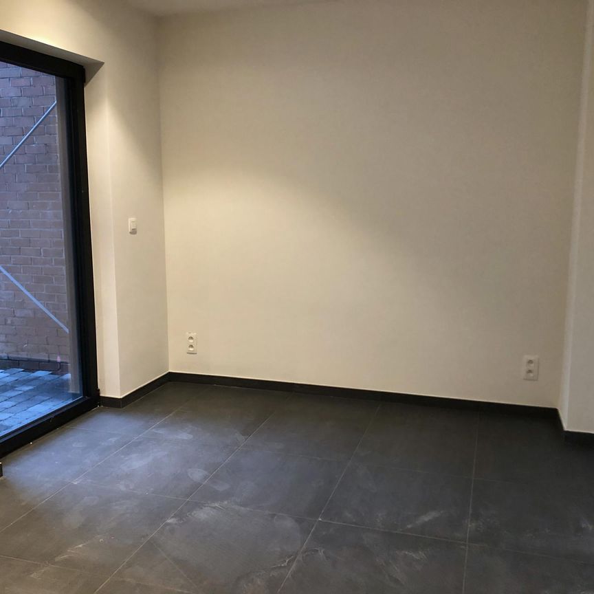 Recent gelijkvloers appartement te huur in het centrum van Oostmalle. - Foto 1