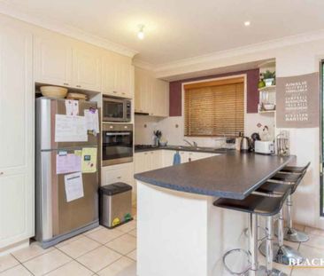 Experience the charm of this captivating three-bedroom home. - Photo 1