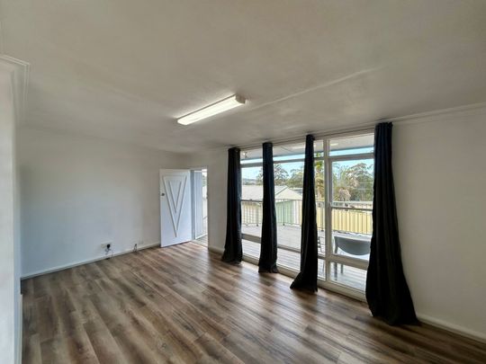 FRESHLY UPDATED HOME IN A FAMILY-FRIENDLY LOCATION - Photo 1