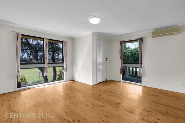 Charming Three-Bedroom Home - Photo 1