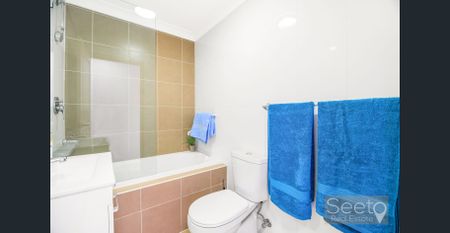 This full-brick, north facing, split-level apartment has timber-style flooring so it's ready to move in and enjoy. - Photo 3