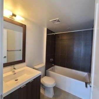 Feels brand new + den parking included indoor pool! - Photo 4