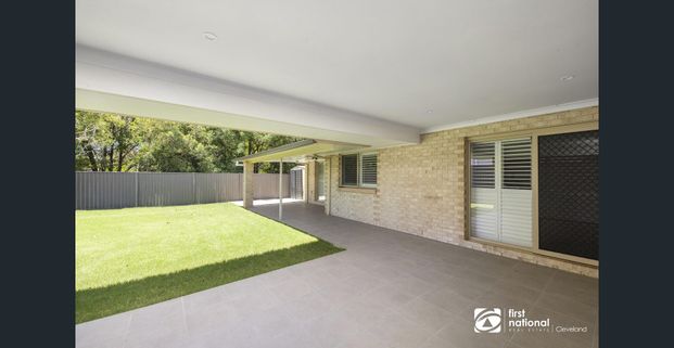 STUNNING LOW SET FAMILY HOME IN WELLINGTON POINT - 4 BEDROOMS + STUDY - Photo 1