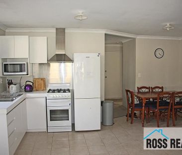 WELL-PRESENTED 3X1 HOME IN ULTRA-CONVENIENT LOCATION - Photo 1