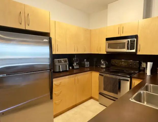 TOP-FLOOR 1+Den BDRM Condo - Springbank Hill | 314 - 69 Springborough Crt SW, Calgary - Photo 1