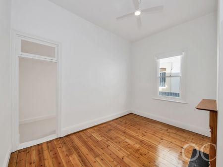 Open the Door to Coastal Charm with Modern Comfort - Photo 2