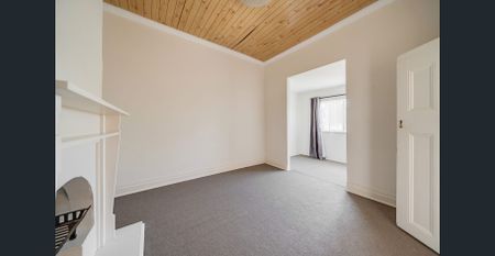 Convenient & Comfortable Living Opposite the Train Station! - Photo 2
